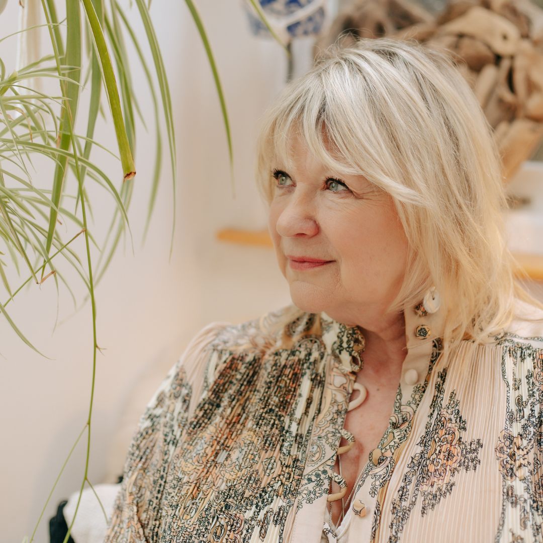 Psychologist and Psychological wellbeing coach, Beverley Harper sits in her therapy room.
