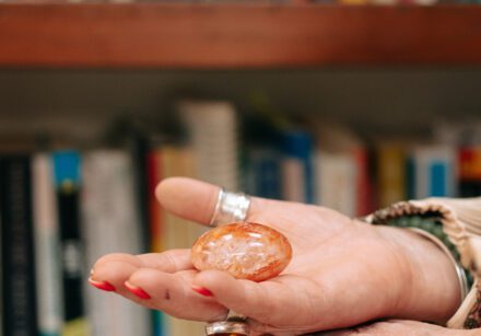 Therapist Beverley Harper holds a crystal in her open hand.