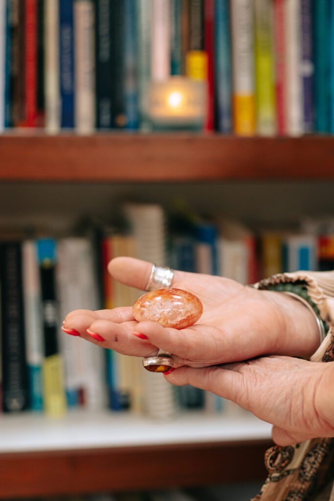 Therapist Beverley Harper holds a crystal in her open hand.
