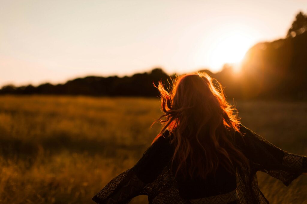 Happy woman walking outdoors.