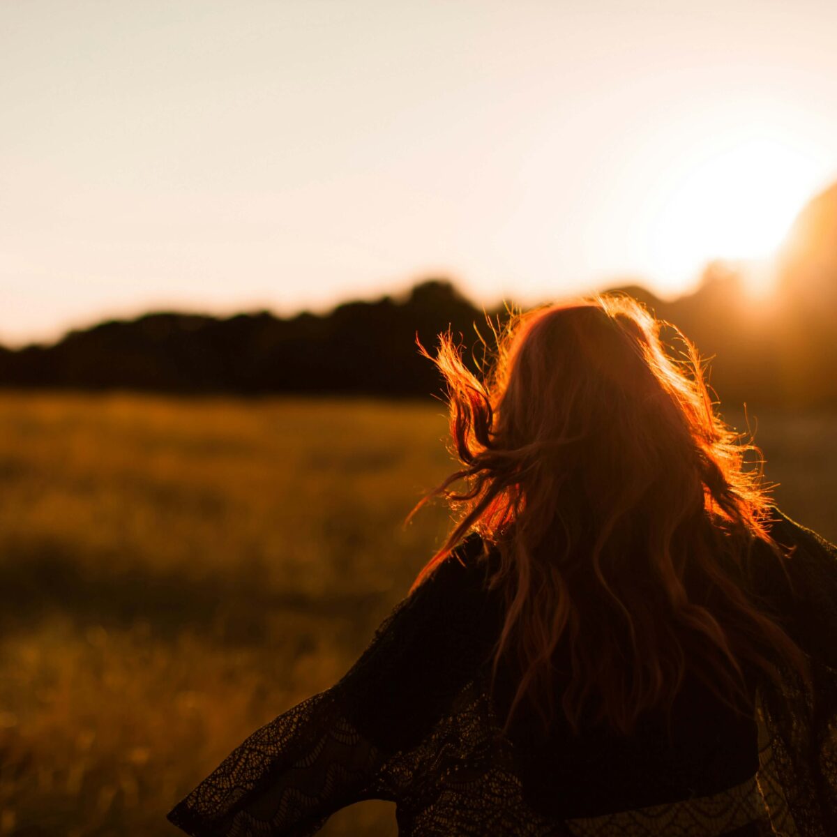 Happy woman walking outdoors.