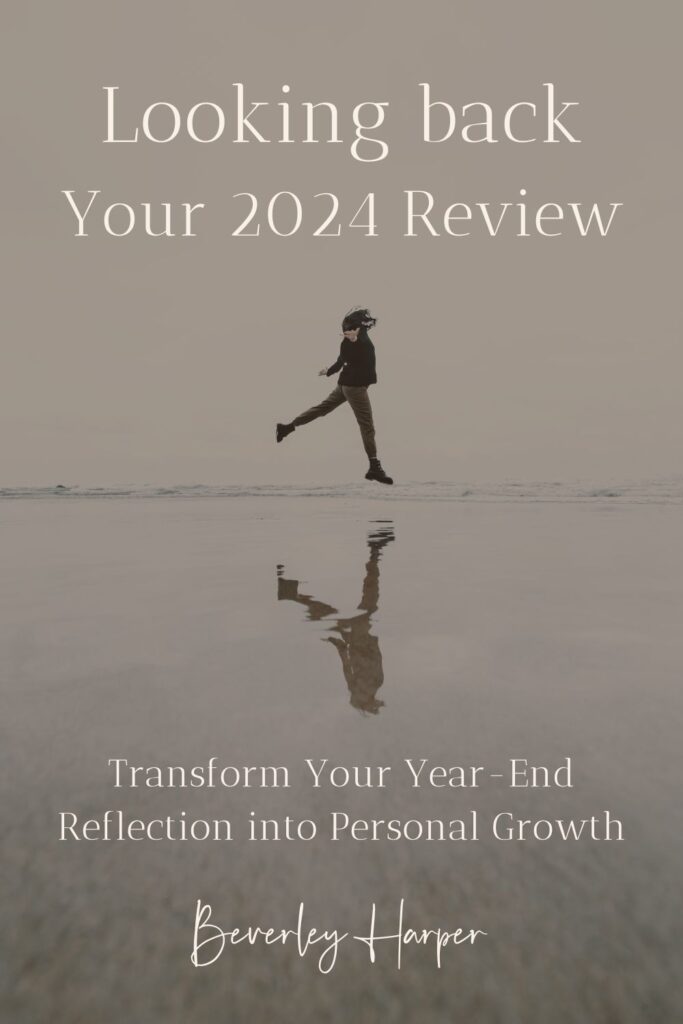Image shows a person at the beach, as they jump high, their image is reflected on the wet sand below them. Text reads: Looking back. Your 2023 Review. Transform Your Year-End Reflection into Personal Growth."