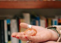 Therapist Beverley Harper holds a crystal in her open hand.