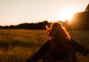 Happy woman walking outdoors.